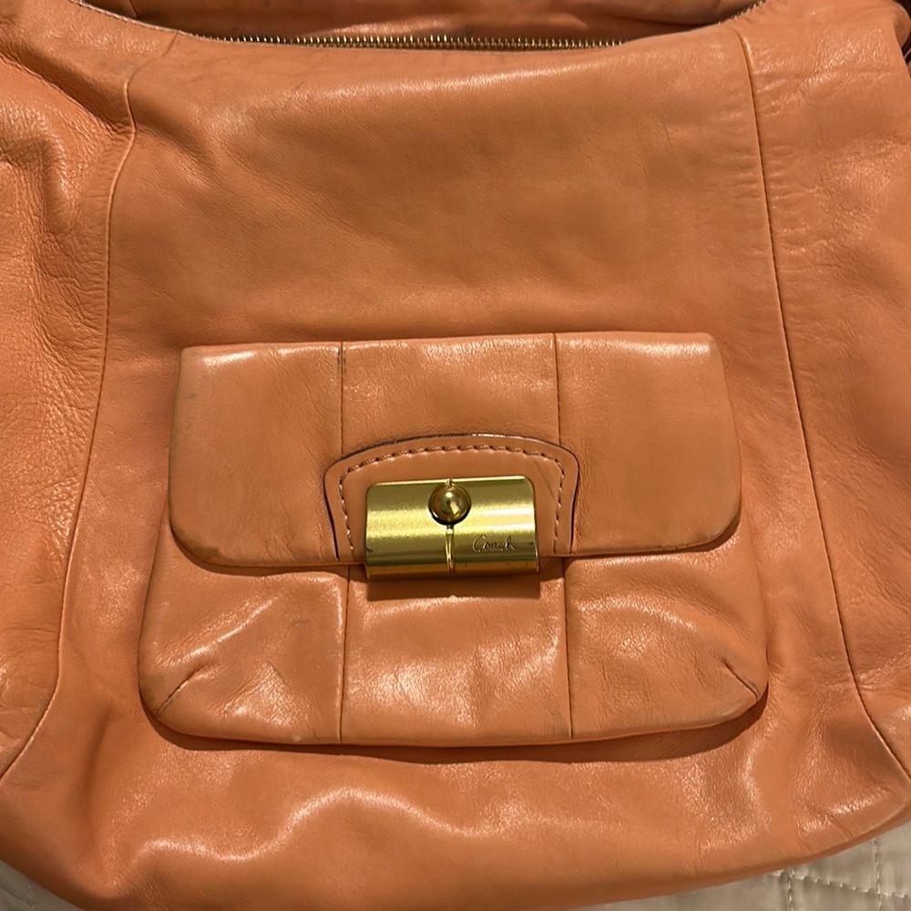 Leather Coach shoulder bag with Crossbody Strap and matching wristlet.